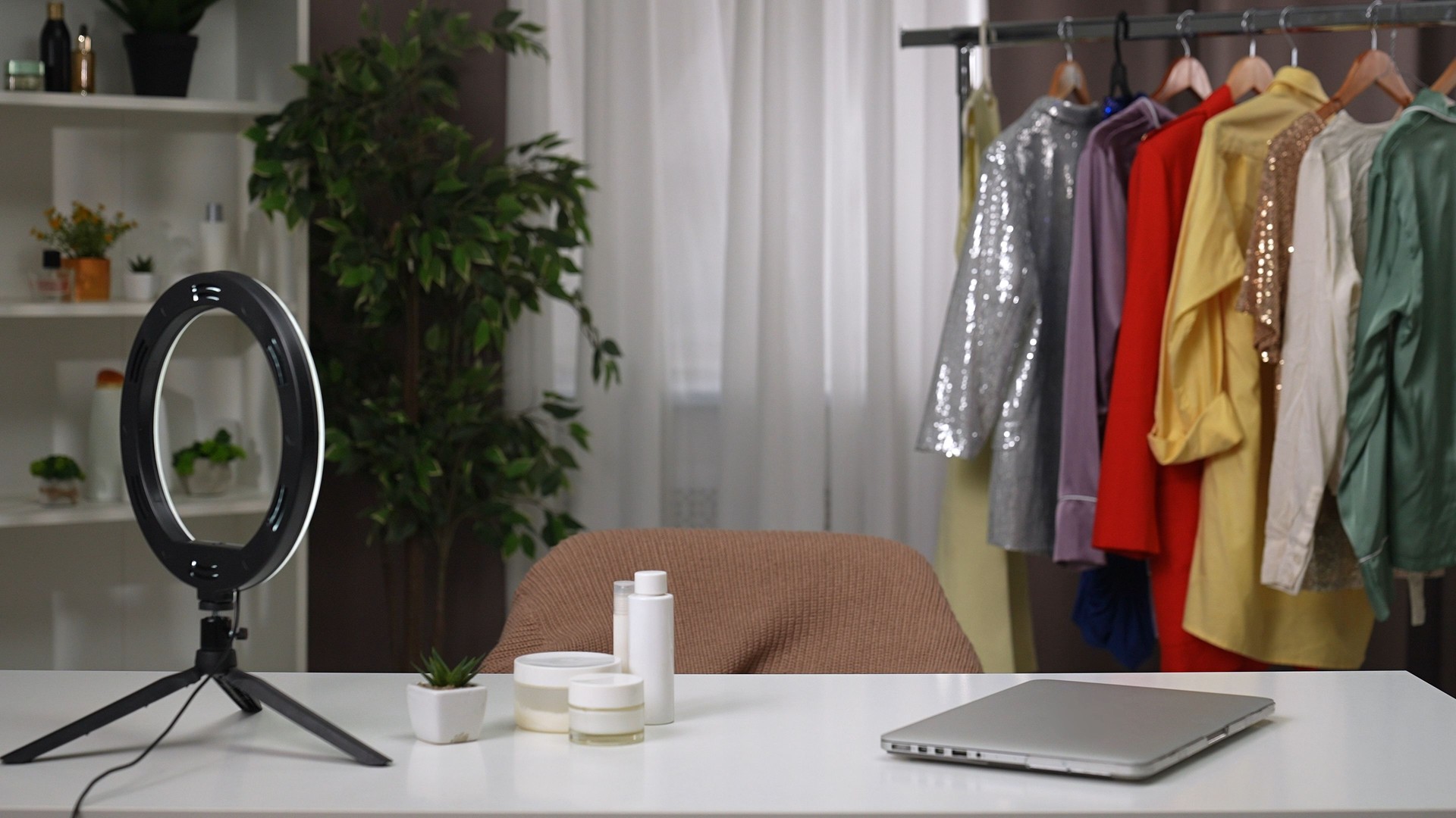 Professional studio with brightly colored clothing for expert beauty and fashion videos.